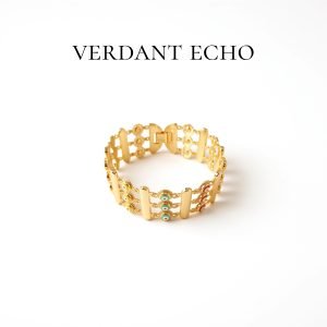 Multi-colored eyes and golden bracelet